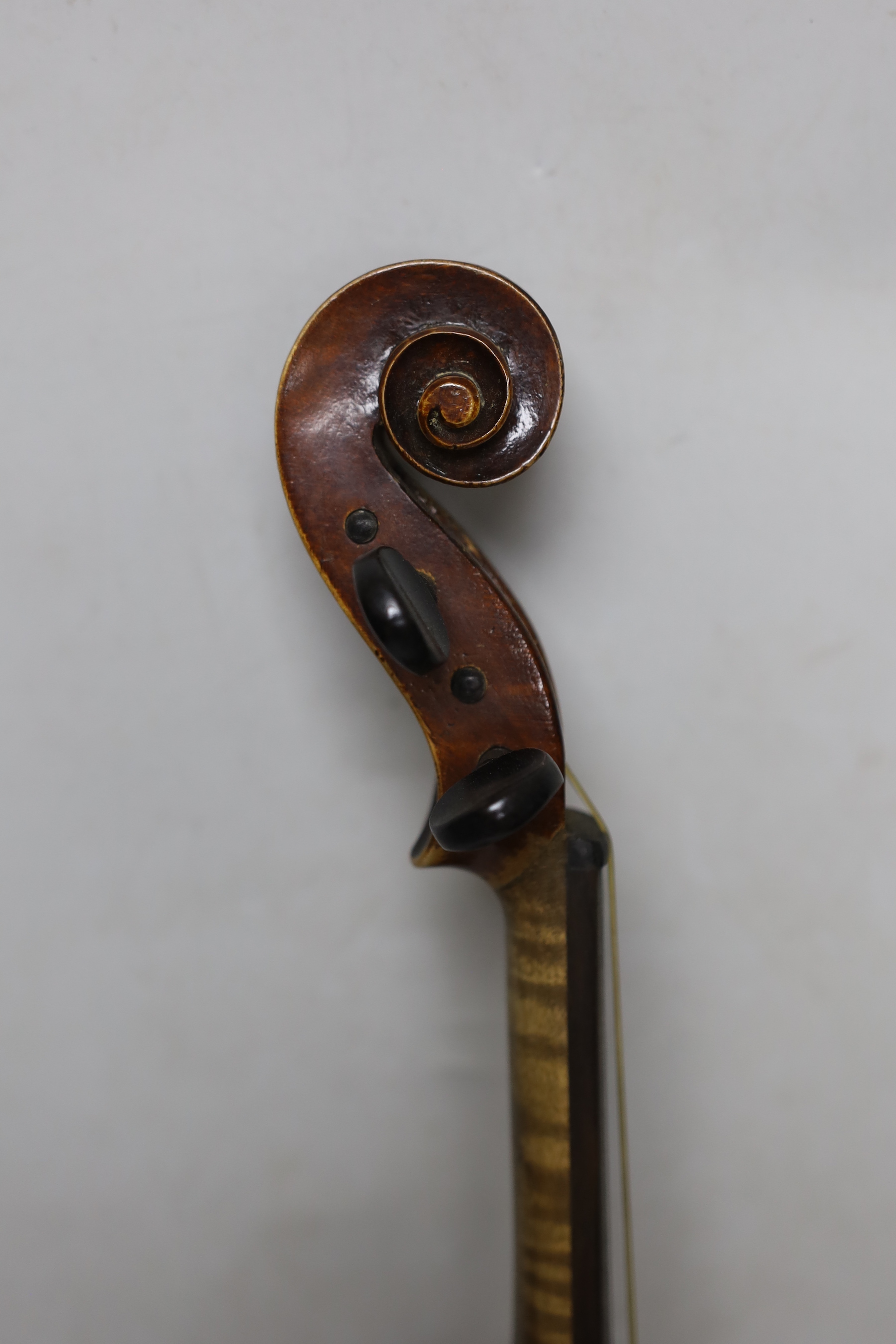 A 19th century cased violin, back measures 36cm excl button